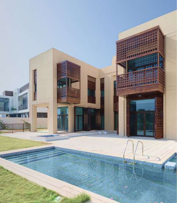 serene scene of a villa with a front pool under Expert Bridge property management services