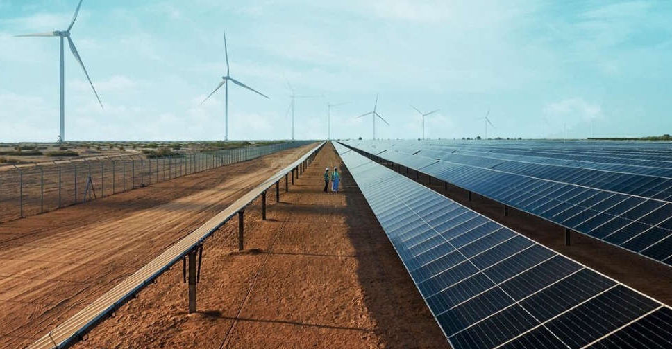 Masdar City's renewable projects with solar panels and wind turbines for sustainability