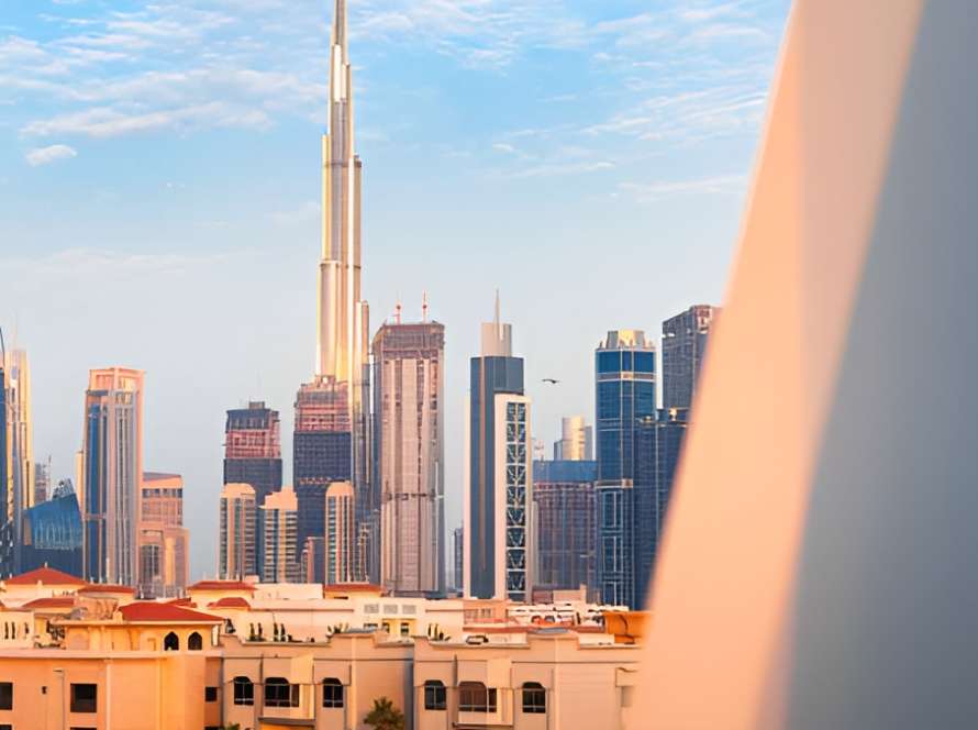 Skyline of Dubai Shown From a Modern Building Frame with Villas in the Foreground